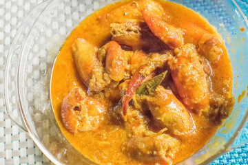 Orange coloured Prawns, cooked and served in a bowl, Indian delicacy food - called 