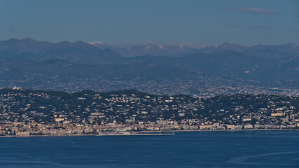 Fototapeta na wymiar Aerial panoramic view of city Cannes at the French Riviera, southern France on the mediterranean coast below the Alpine mountains on sunny day.