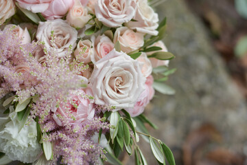 Wedding flowers, bridal bouquet closeup. Decoration made of roses, peonies and decorative plants, close-up, selective focus, nobody, objects. Wedding day.