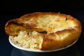 Homemade cabbage pie on a white plate