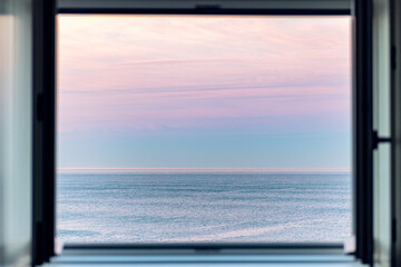Sunrise over Atlantic Ocean through the open window