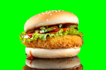 Cheeseburger hamburger isolated on green background. BBQ sauce and lettuce.