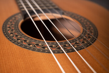 Classical guitar on black background. Acoustic guitar concept.Perfect for flyer, card, poster or...