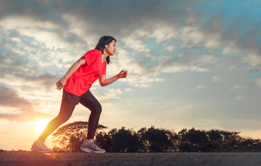 A woman is in preparation for running. Running is an exercise that can be done anywhere, anytime....