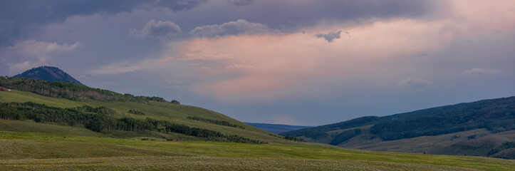 Panoramic view of rolling hills with evening sky near Crested Butte, Colorado