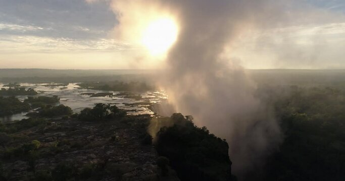 Aerial drone footage of Victoria Falls, Zimbabwe during sunrise