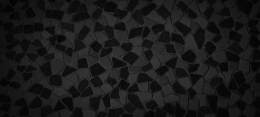 Black gray grey natural pebble stone tile floor texture background banner, top view.