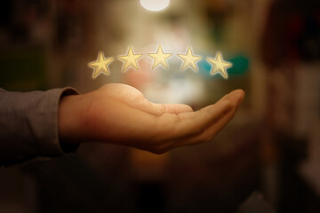 hand hold five golden rating stars show excellent service