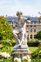 Obraz premium The Snake Charmer statue in the Palais-Royal garden in Paris, France.