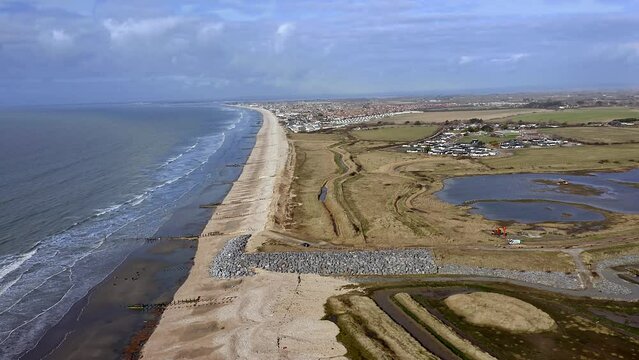 Aerial footage of Medberry nature reserve a haven for birds on the South Coast of England in Bracklesham Bay.