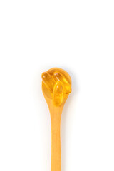 Vitamin D 3 supplement on a spoon isolate on a white background. Selective focus.