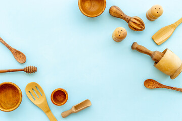 Flat lay of wooden kitchen utensils and cookware