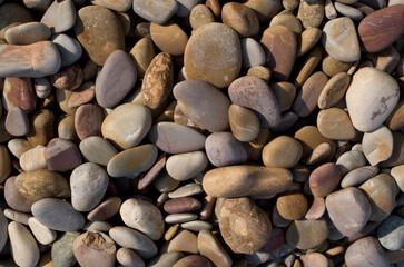 Heap of colorful rounded river stones close