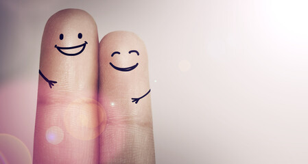 Were two of a kind. Cropped shot of fingers with smileys drawn on them.