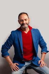 Portrait of sexy mature grey bearded man. Stylish bearded senior bearded man looking at camera isolated on grey background.