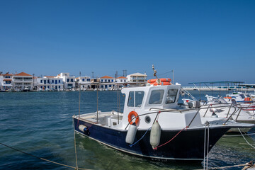 Fototapeta premium Traditional Fishing boat anchored at Elafonisos island port Greece. Sunny summer day
