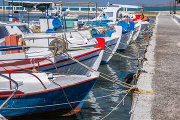 Fishing boat anchored at Elafonisos island port Greece. Blue sky background. Sunny summer day