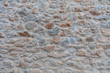 Stone wall texture background. Old stonewall traditional pattern building facade, natural material