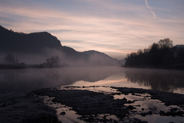 foggy winter morning on the Adda river in Brivio Lombardy - 489251658