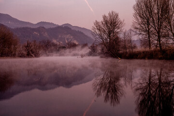 foggy winter morning on the Adda river in Brivio Lombardy - 489251675