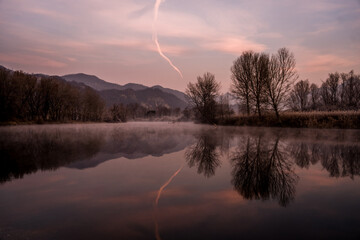 foggy winter morning on the Adda river in Brivio Lombardy - obrazy, fototapety, plakaty