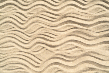 Texture of sea sand background closeup with ornament