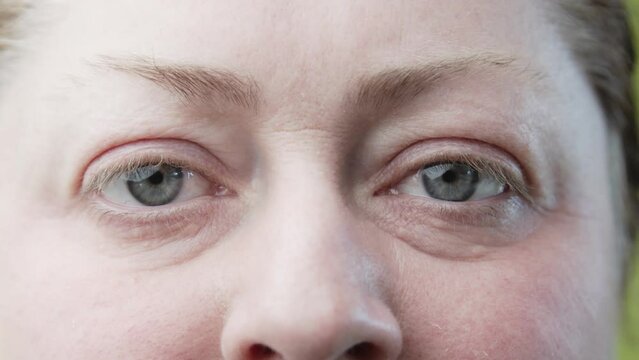 Close-up portrait of a middle-aged woman without makeup