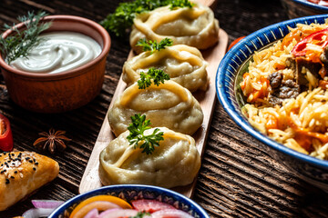 Traditional manti food on plate, top view. The concept of oriental cuisine. Uzbek food manty dumplings. Uzbek food. banner, catering menu recipe place for text