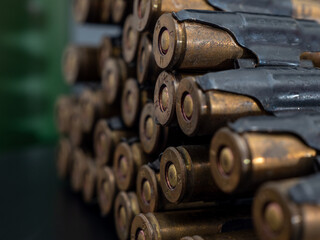 Cartridges from a machine gun on a black background