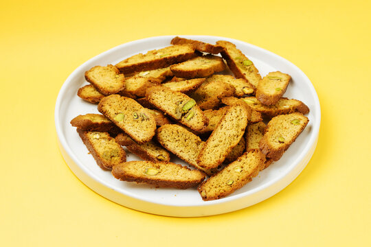 Heap of biscotti on white table
