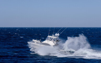 Sportfishing boat returns to the anchorage in 20 knot winds at Magdalena bay in Baja, Mexico