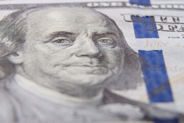 One hundred dollar bills fragments close-up. horizontal