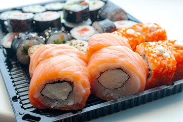 Rolls with salmon and flying fish caviar. Sushi menu. Japanese food.
