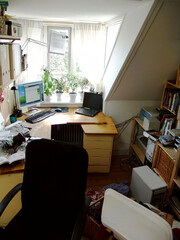 Bachelors Dorm Room. A candid image of a home workspace.