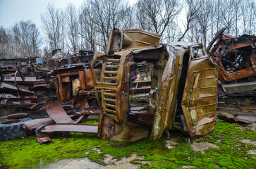 Piles of old rusty soviet crushed trucks in scrap metal yard. Car recycling