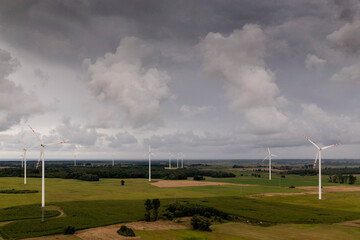 Going green with a wind power from a modern eco windmill turbine.