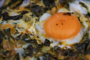 keto diet. Healthy omelet with spinach. Eggs with spinach in a frying pan.