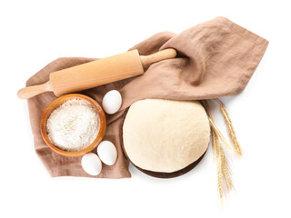 Raw dough with flour, rolling pin and eggs on white background