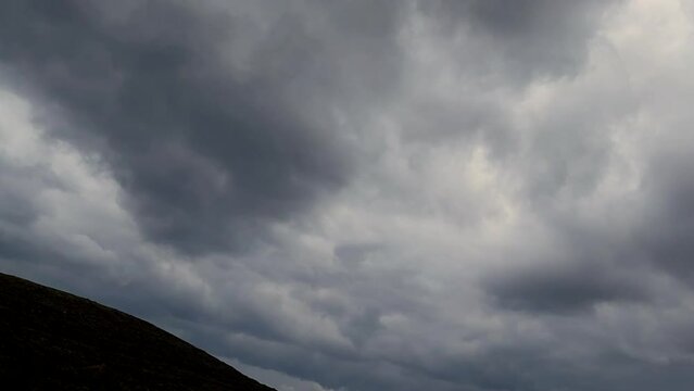 Cloudscape Time Lapse. Movie. Dramatic overcast day on the island of Syros in Greece.