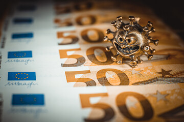 Gold virus on a fifty euro banknote. Concept with bank virus money