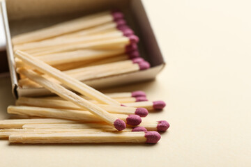 Matchbox with matches on color background, closeup