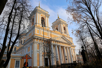 Cathedral of the Alexander Nevsky Lavra in St. Petersburg, Russia. Autumn view with trees without...