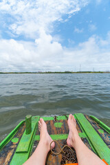 Raft ride at the mouth of the river where the water of the Ipojuca River meets the sea water in the...