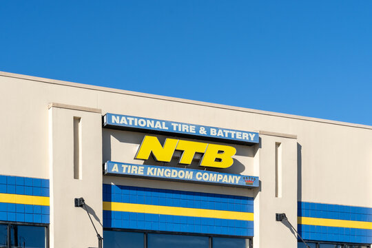 Pearland, Texas, USA - February 14, 2022: Closeup of NTB-National Tire and Battery shop sign on the building. 