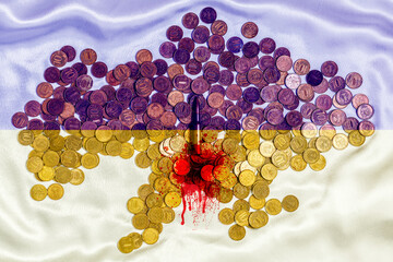 The live cartridge of the Kalashnikov assault rifle on the coins of the Russian currency against...