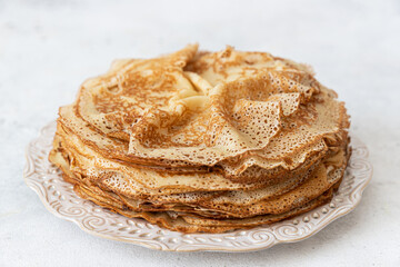 Homemade crepes on a white plate