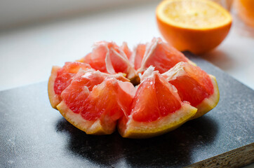 Close-up of a peeled red grapefruit. Benefits of citrus fruits.