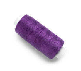 Purple sewing thread spool on white background
