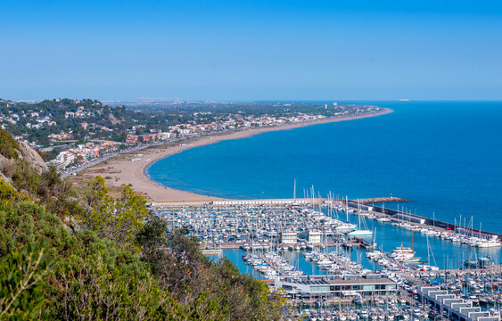 Views of Castelldefels and the beach, Port Ginesta harbor with sailing boats, near Barcelona, Spain