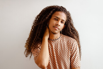 Portrait of a man with long curly hair
